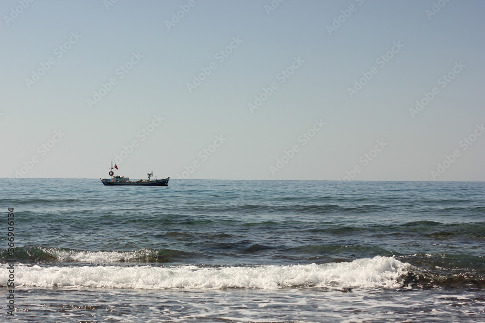 Alanya, TURKEY - August 10, 2013: Travel to Turkey. Beaches on the sea. Waves on the Mediterranean coast.