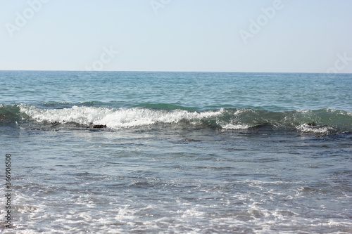 Fototapeta Naklejka Na Ścianę i Meble -  Alanya, TURKEY - August 10, 2013: Travel to Turkey. Beaches on the sea. Waves on the Mediterranean coast.