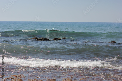 Alanya, TURKEY - August 10, 2013: Travel to Turkey. Beaches on the sea. Waves on the Mediterranean coast.