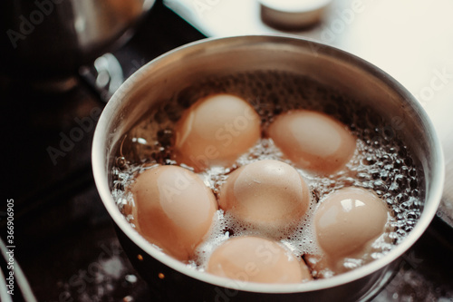 Eggs are boiling with high temperature. Cooking chicken eggs in pot. Boiled eggs.
