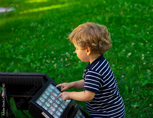 Little boy plays outdoors. Child © rubchikova