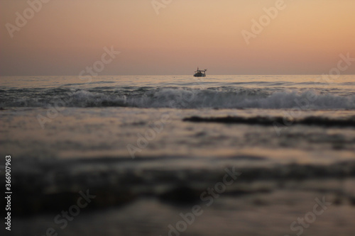 Alanya, TURKEY - August 10, 2013: Travel to Turkey. Sunset at the sea. The sun is leaving the horizon.