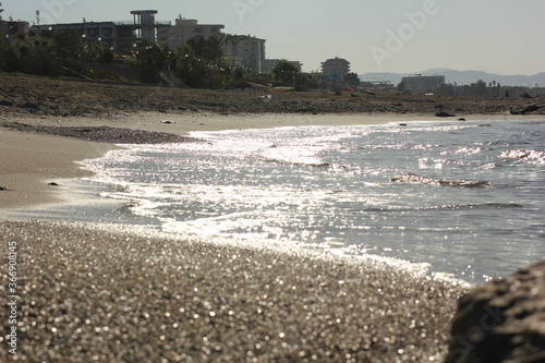 Fototapeta Naklejka Na Ścianę i Meble -  Alanya, TURKEY - August 10, 2013: Travel to Turkey. Beaches on the sea. Waves on the Mediterranean coast.