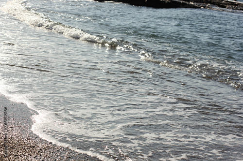 Fototapeta Naklejka Na Ścianę i Meble -  Alanya, TURKEY - August 10, 2013: Travel to Turkey. Beaches on the sea. Waves on the Mediterranean coast.