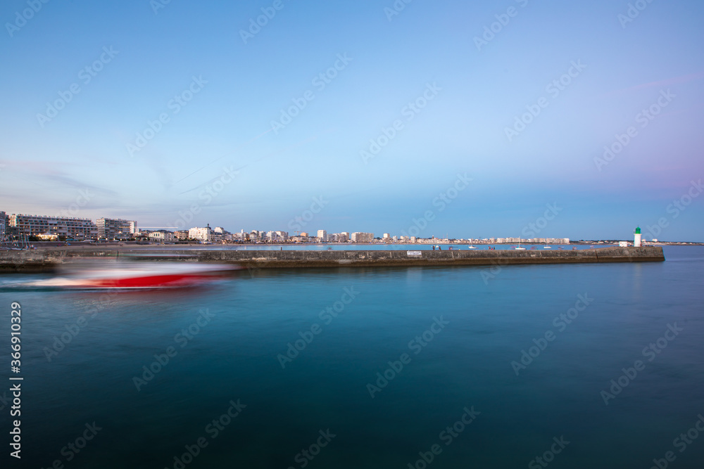 Entrance of Les Sables D'Olonne harbour taken from La Chaume, with it piers and lighthouse at sunset, Vendee, France Entrance of Les Sables D'Olonne harbour taken from La Chaume, with it piers and lighthouse at sunset, Vendee, France
