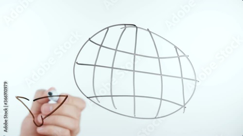 Shooting of man drawing planet with longitude and latitude photo