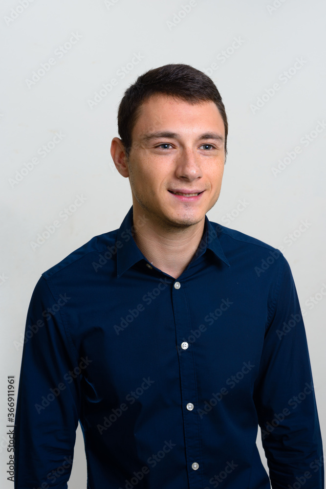Portrait of handsome businessman against white background Portrait of handsome businessman against white background