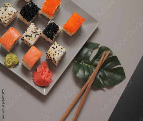 Japanese sushi rolls on dark background.  photo