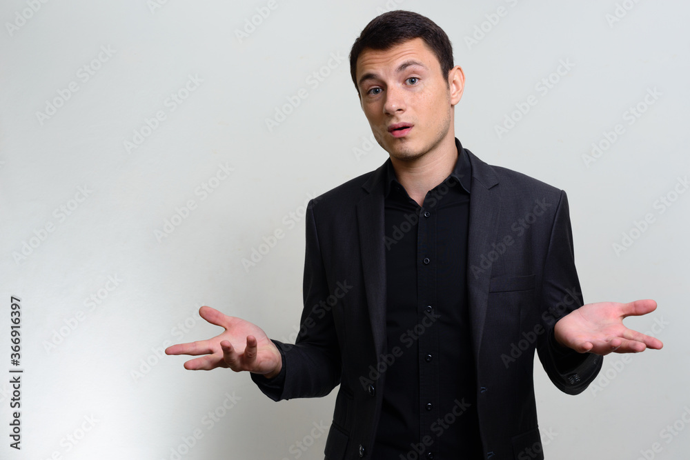 Studio shot of handsome businessman in suit Studio shot of handsome businessman in suit