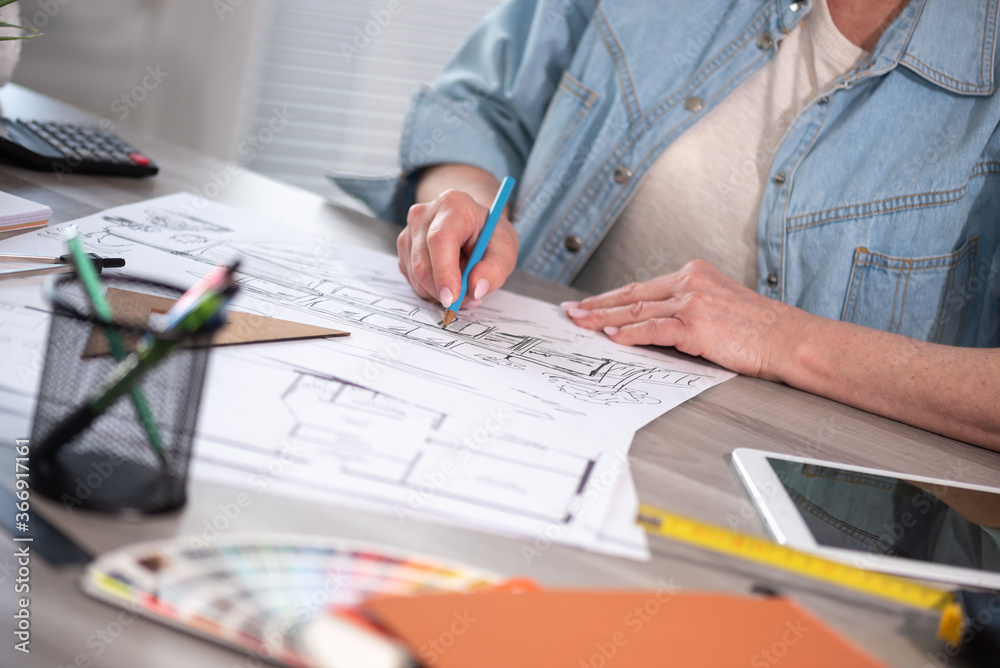 Female architect working on sketch Female architect working on sketch
