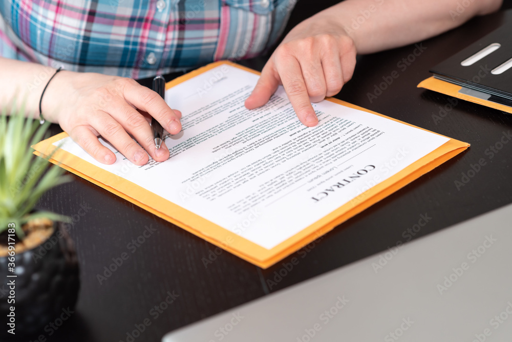 Fototapeta premium Female lawyer checking contract