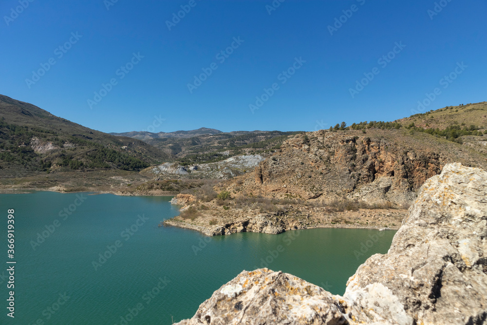 Beninar reservoir surrounded by mountains