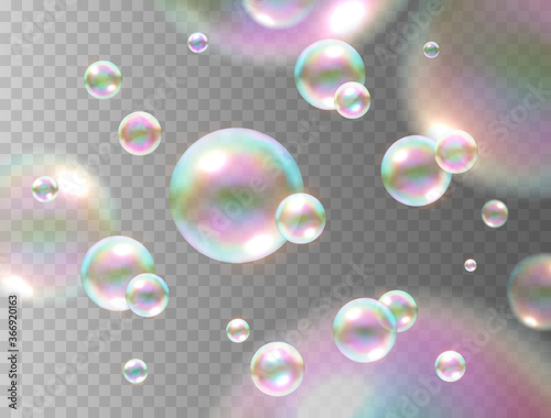 Soap bubble with rainbow colors isolated on transparent background. Realistic vector water foam elements. Colorful iridescent balls or spheres template