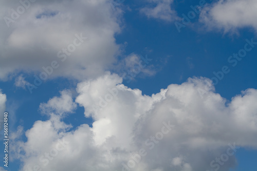 Cumulus clouds. Blue sky. Natural background.