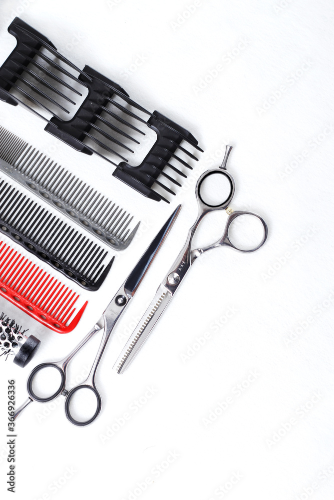 professional hairdresser tools for stylists and hairdressers. on a white background, vertical, copy space professional hairdresser tools for stylists and hairdressers. on a white background, vertical, copy space