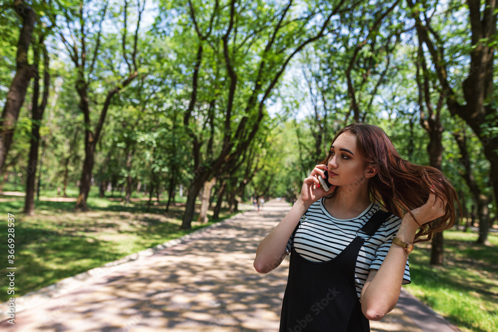 Phone conversation in a city Park Phone conversation in a city Park
