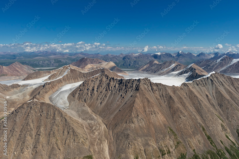 Fototapeta premium Aerial view over the Central Tian Shan Mountain range, Border of Kyrgyzstan and China, Kyrgyzstan