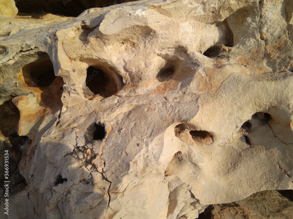 The structure of a stone on the Mediterranean coast close up.