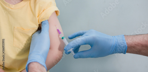 Vaccination concept with child in clinic
