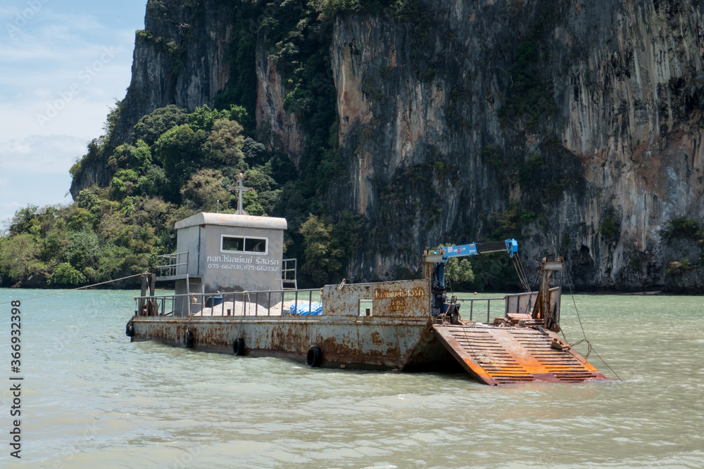 Work barge at East Railay Beach, west of Krabi in southern Thailand. Work barge at East Railay Beach, west of Krabi in southern Thailand.