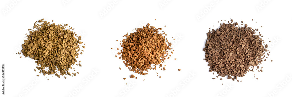 Color various of instant coffee. Granules heap isolated on white, top view Color various of instant coffee. Granules heap isolated on white, top view