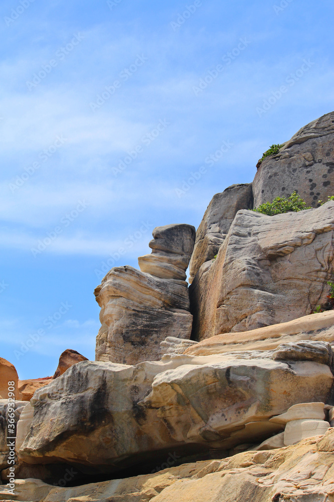 Top of a rocky cliff with a blue sky. Clovelly Beach, Sydney.