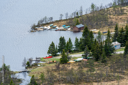 fishing boats shot from above at furusjoen in rondane national park in norway.