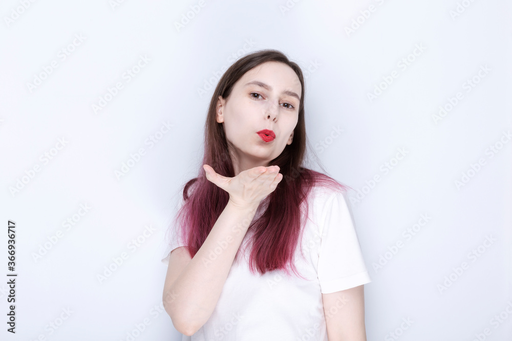 Young girl giving air kiss. World Kissing Day Concept Young girl giving air kiss. World Kissing Day Concept
