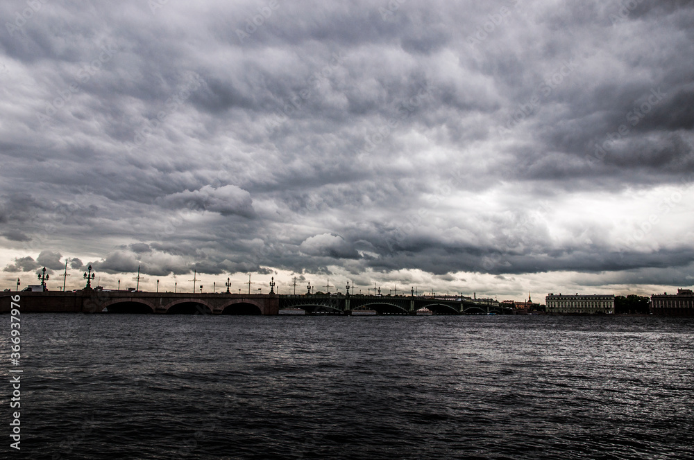 Storm clouds over the river, bridge over river