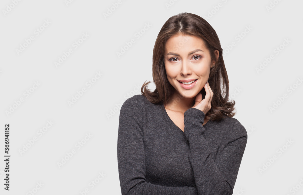 Joyful young woman close up portrait, Smiling cute girl with long hair studio shot, Isolated on gray background. People, beauty, emotions, enjoy life concept Joyful young woman close up portrait, Smiling cute girl with long hair studio shot, Isolated on gray background. People, beauty, emotions, enjoy life concept