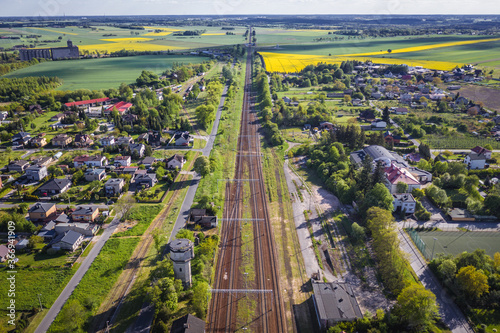 Drone view above railway tracks in Rogow village, Lodz Province of Poland