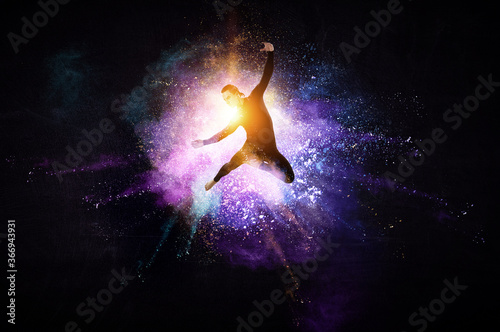 Male dancer against colourf...
