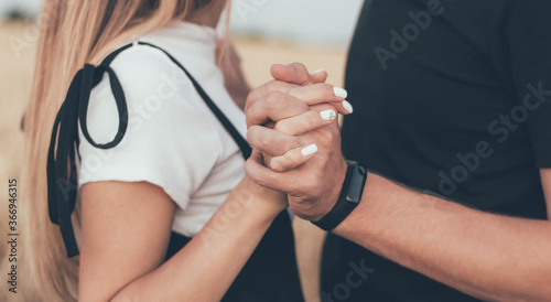 Woman s hands hugging man s hands