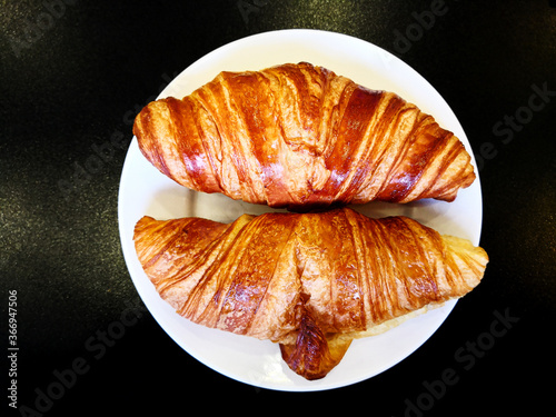 Delicious fresh croissant on table