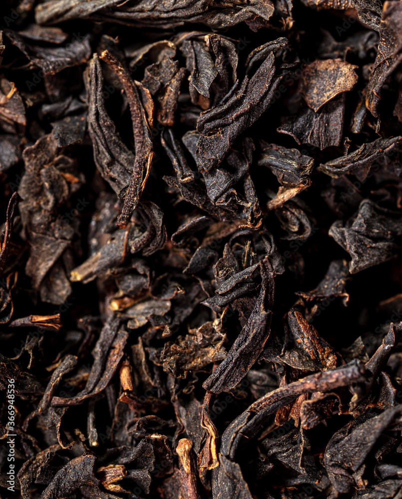 Close up of granules of black tea as a background. Close up of granules of black tea as a background.
