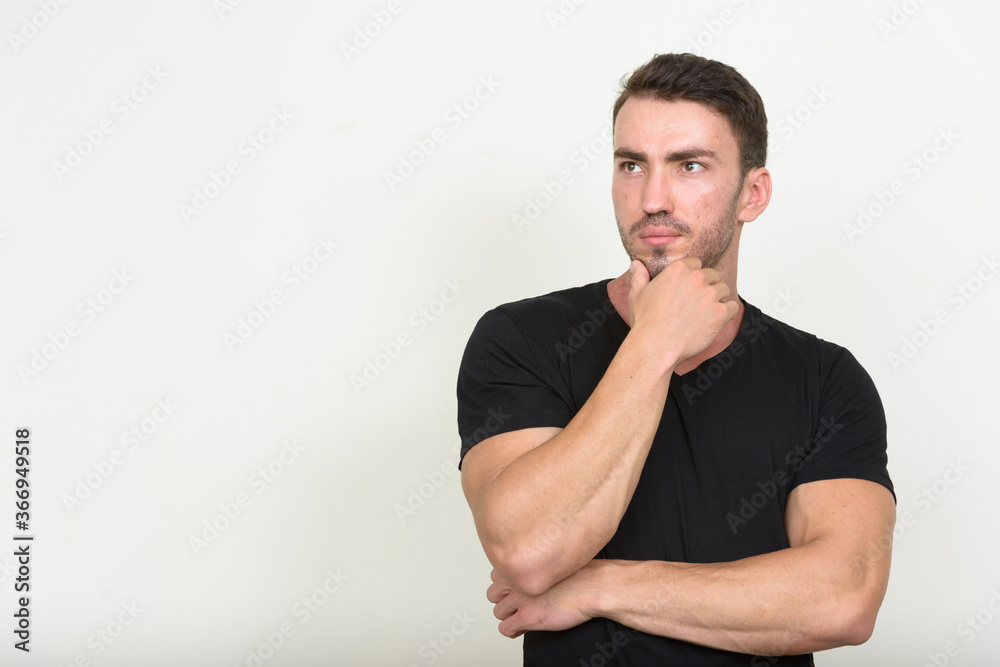 Portrait of handsome bearded man against white background
