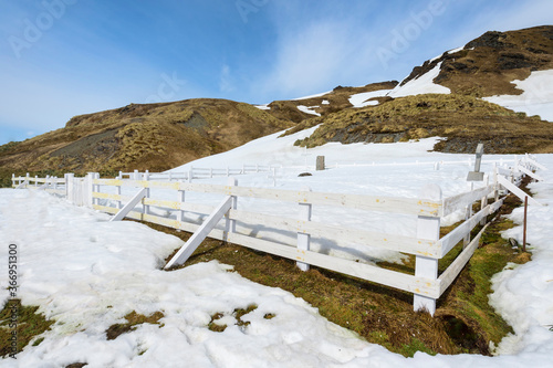 Grytviken cemetery with Ernest Shackleton’s grave under snow, King Edward Cove, South Georgia, South Georgia and the Sandwich Islands, Antarctica photo