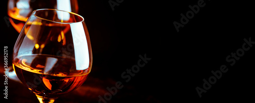 Quadro em tela Grape brandy in shot glass, dark brown background