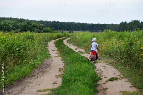 children walk in the village on a rural road