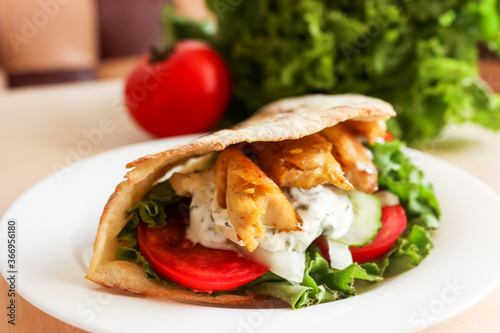 turkish fast food - chicken in pita bread, Doner kebab - fried chicken meat with vegetables in pita bread