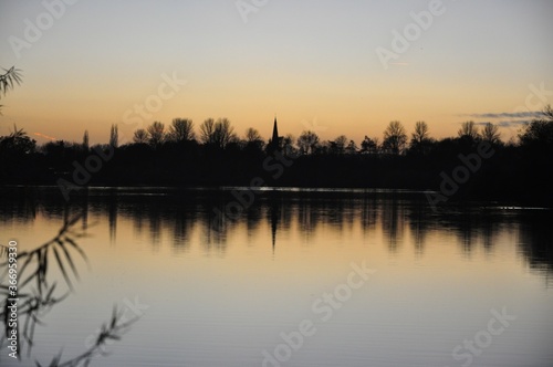 Winter sunset reflected in lake © Gareth