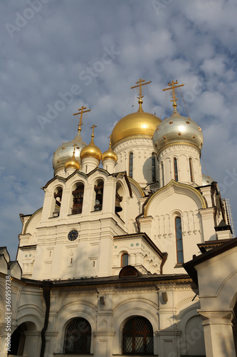 Zachatyevsky Monastery Katholikon in Ostozhenka district, Moscow city, Russia. Nativity of Virgin Mary Cathedral. Orthodox church. Blue cloudy sky. Moscow landmark, old religious architecture monument photo