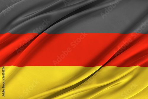 Colorful German flag waving in the wind. High quality illustration.