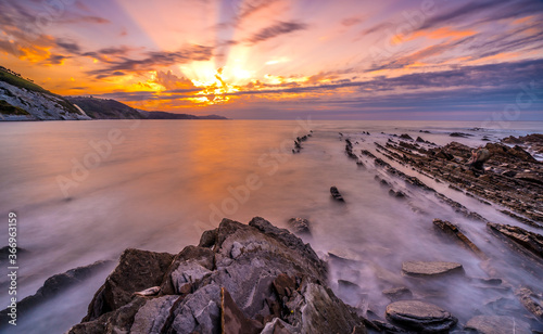 Stones at sunset of the Geopark called Flysch on the beach of Sakoneta in the town of Deba, at the western end of the Geopark of the Basque Coast, Guipúzcoa. Basque Country © unai
