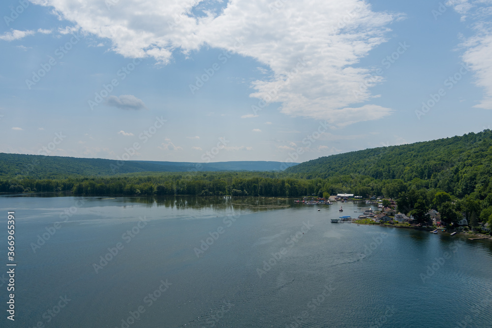 Aerial view of the south end of Owasco Lake near Moravia, Cayuga County, New York. A marina is on the right. 