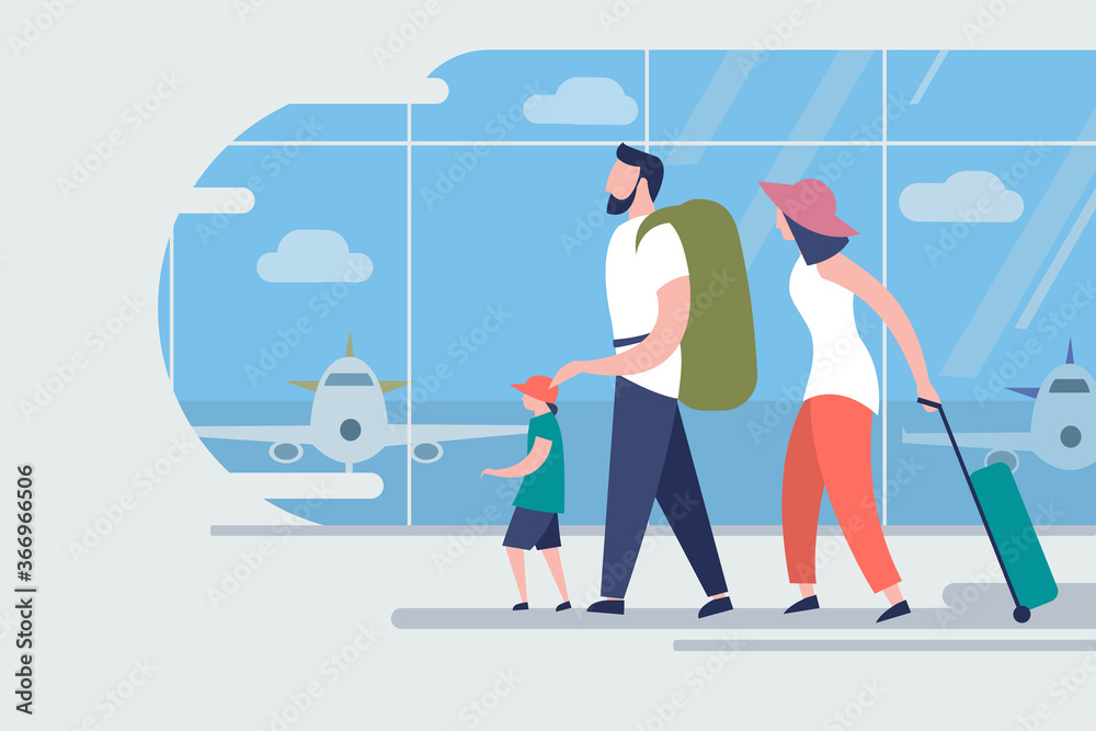 Fototapeta premium Family on a vacation trip walking in an airport to board a flight
