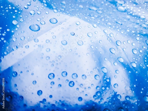 Water droplets on the blue background abstract texture