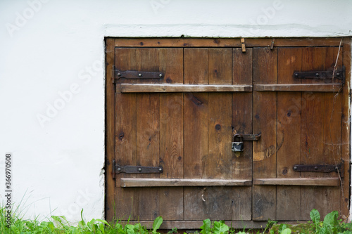 Wallpaper Mural old wooden door on a white stone wall background Torontodigital.ca