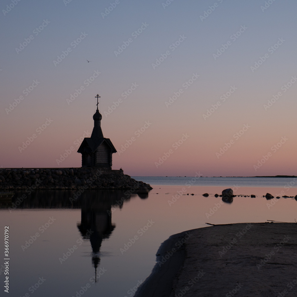 Fototapeta premium A small chapel in the background of the sunset.