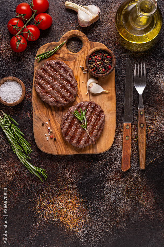 Fried cutlet for burger on a wooden board. Fried cutlet for burger on a wooden board.